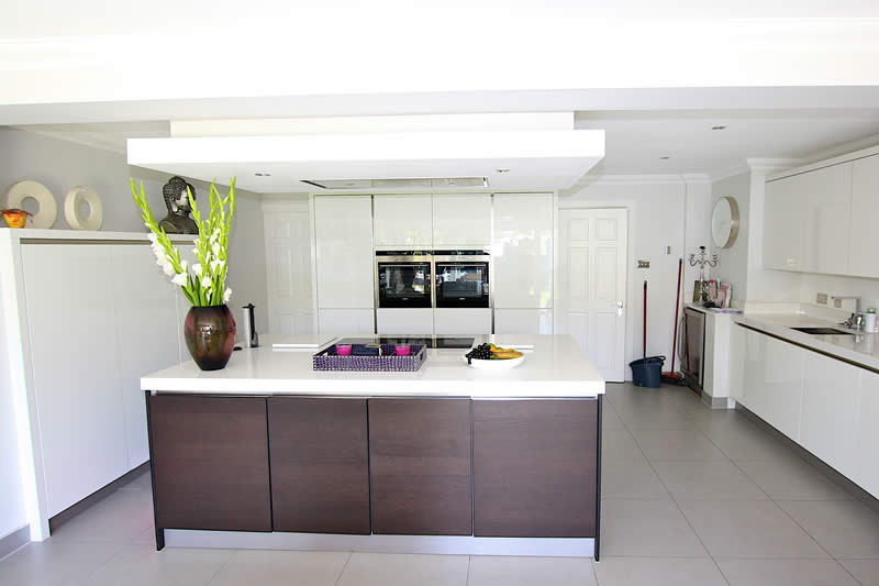 6. Polar White High Gloss Kitchen With Tobacco Oak Kitchen Island 1 | Lead Wolf, Peterborough